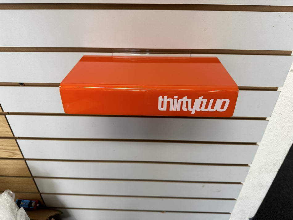 Slatwall shoe shelf Orange with printed logo